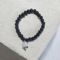 Onxy beaded bracelet with pink flower charm